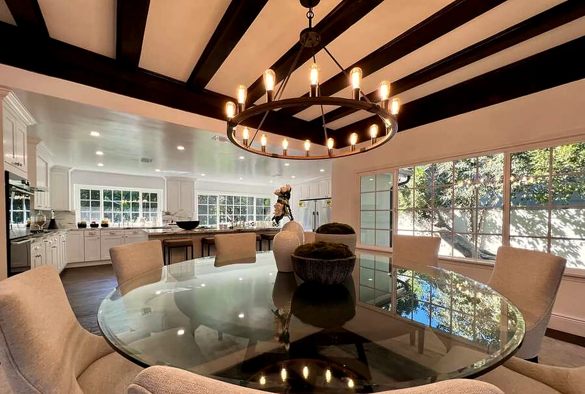 Formal dining room with beamed ceiling and chandelier in Encino